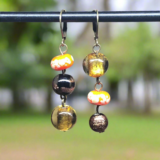 Gwynedd - Mismatched orange glass bead earrings