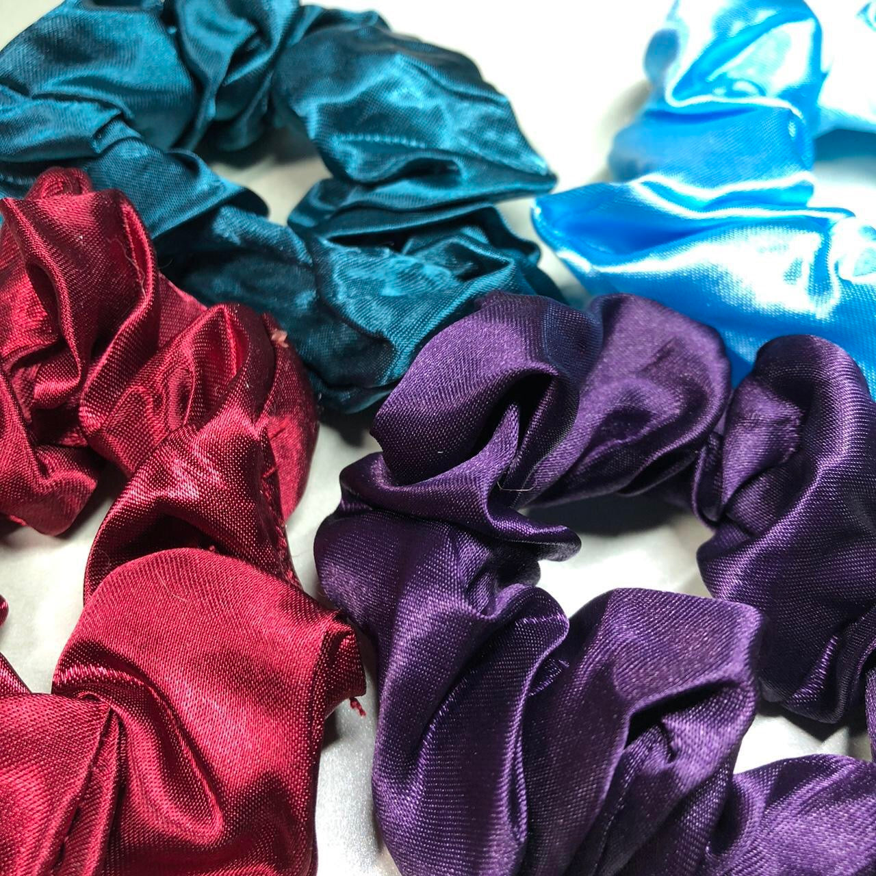 Four colourful hair scrunchies