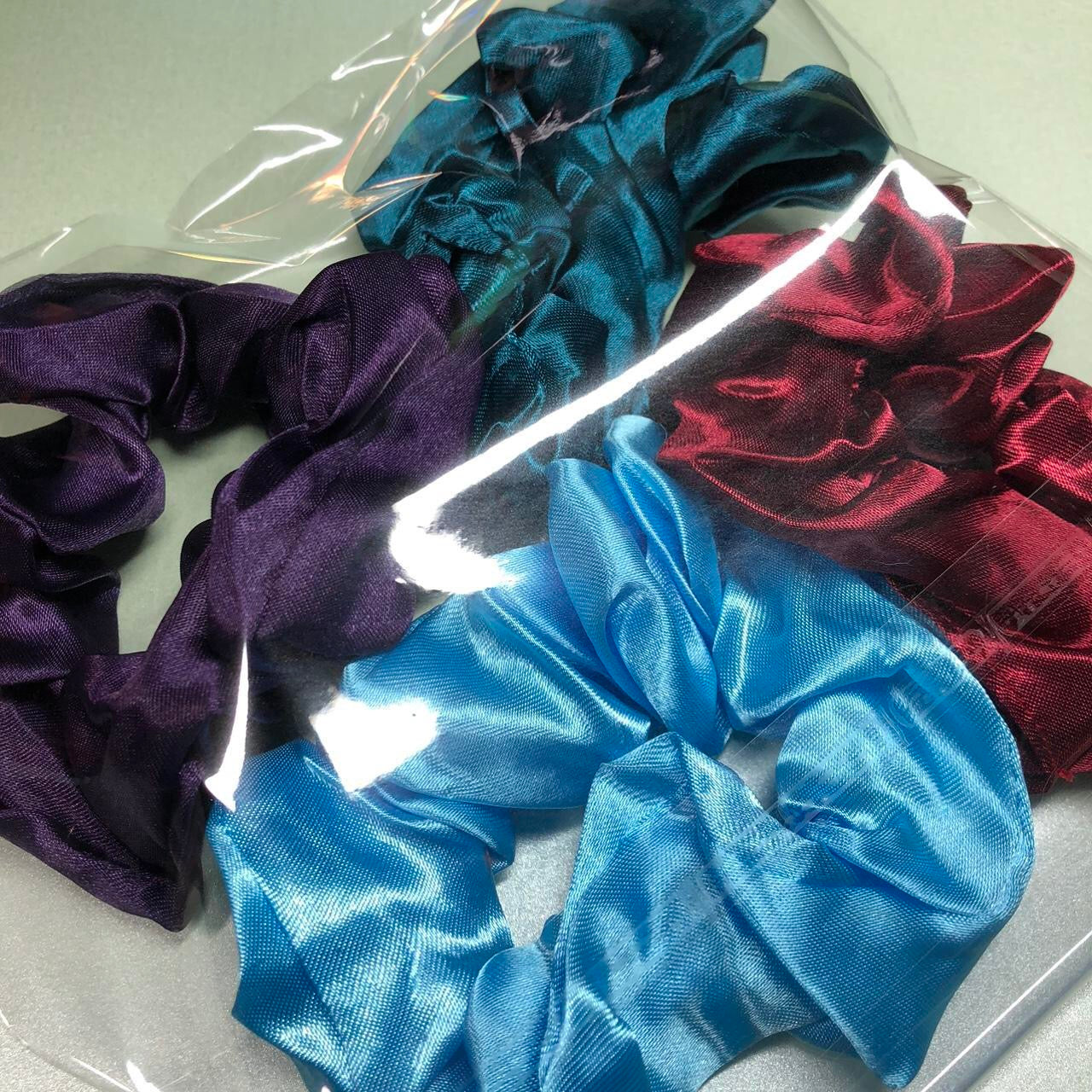 Four colourful hair scrunchies