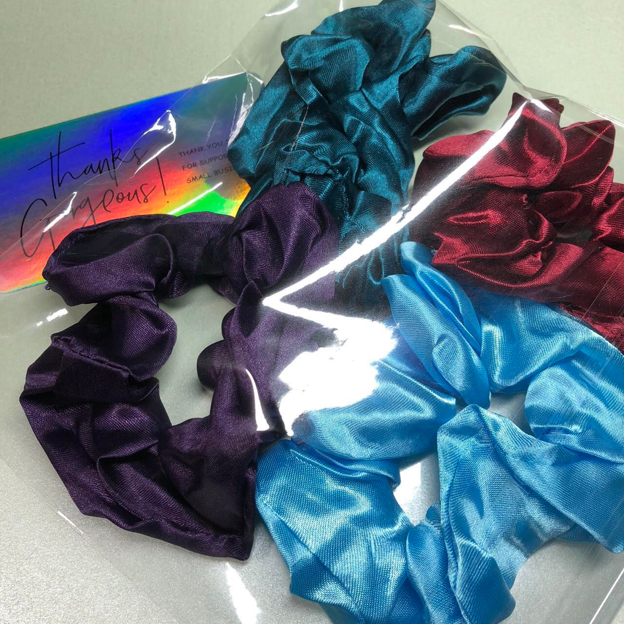 Four colourful hair scrunchies