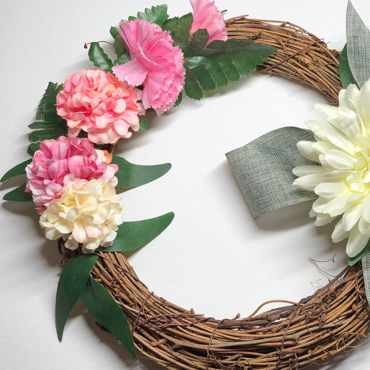 Willow cream floral hanging wreath decoration.