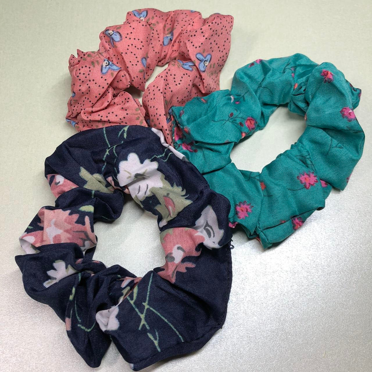 Three colourful floral hair scrunchies