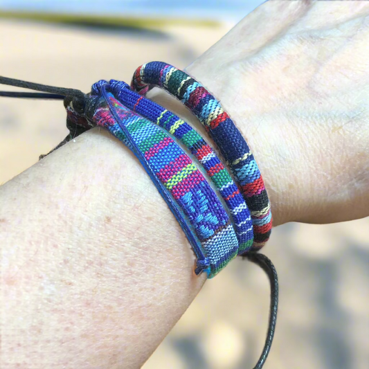 Three blue handmade multicolour string cord braided woven stackable bracelets