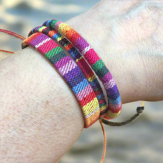 Three rainbow handmade string cord braided woven stackable bracelets