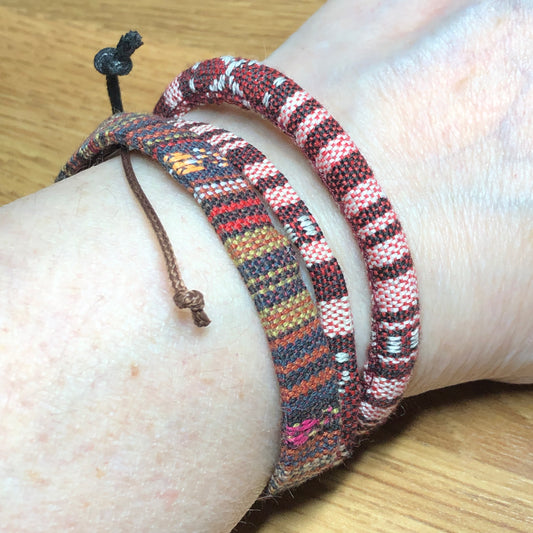 Three brown handmade Bohemian cord braided woven stackable bracelets