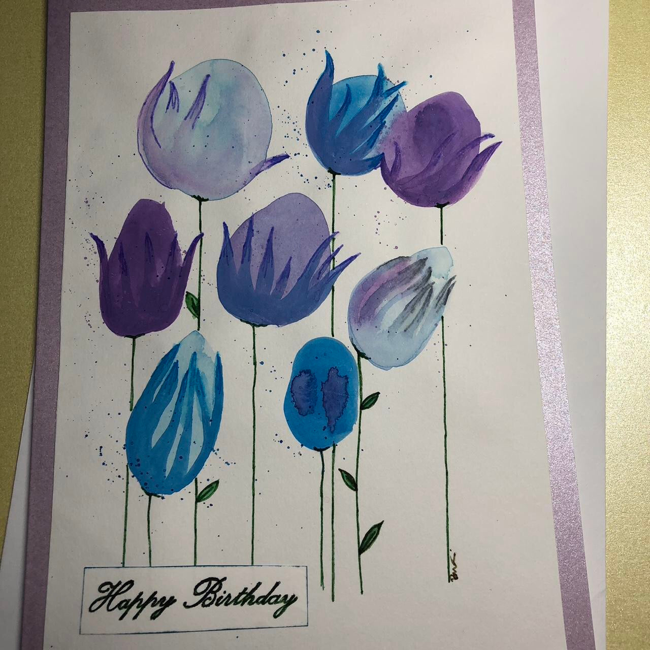 Rounded blue and purple flower watercolour birthday card