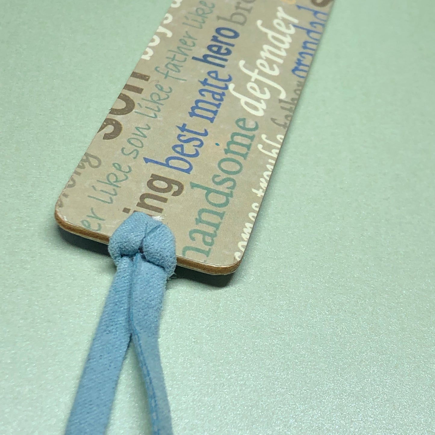 Male theme wood and suede bookmark