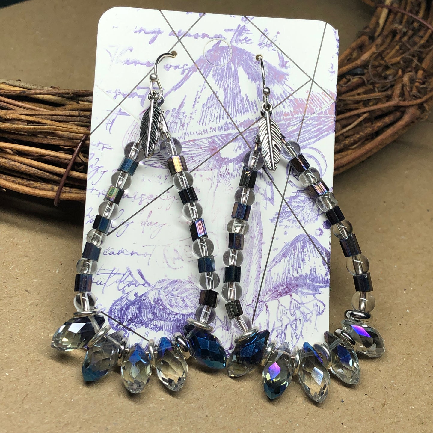 Crystal teardrop hoop earrings with feathers charms