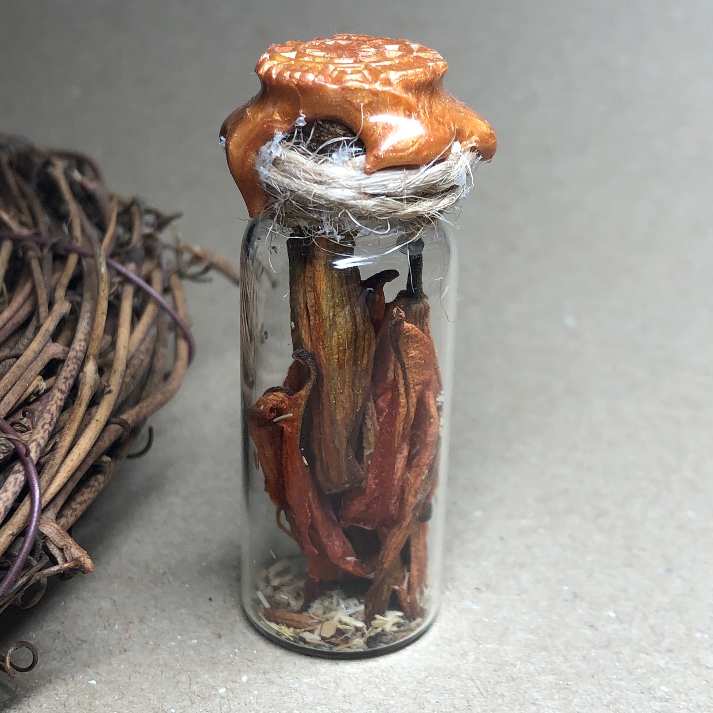 Fiery flower filled decorative apothecary bottle