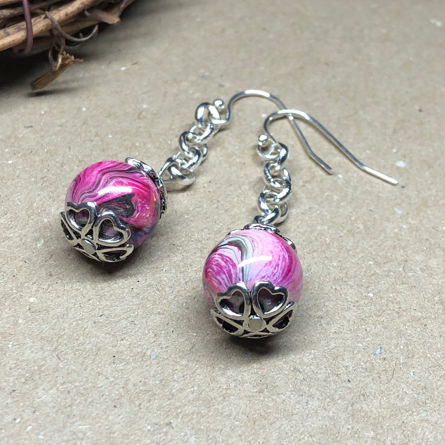 Pink swirl dangle earrings