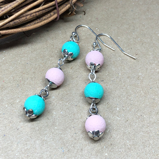 Mismatched pink cyan lava rock earrings