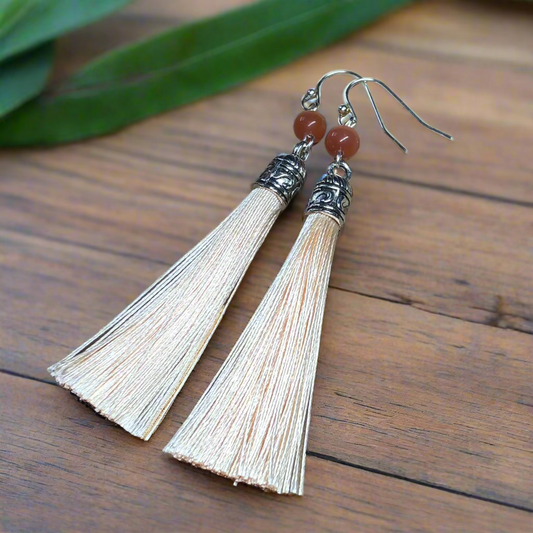 Pandora - Peach tassel earrings with cats eye glass