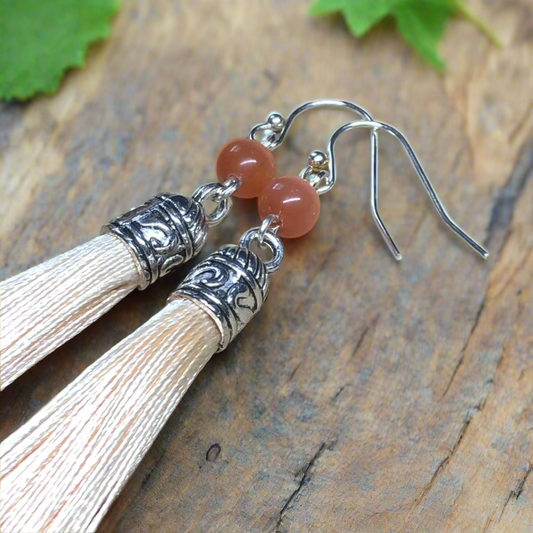 Pandora - Peach tassel earrings with cats eye glass