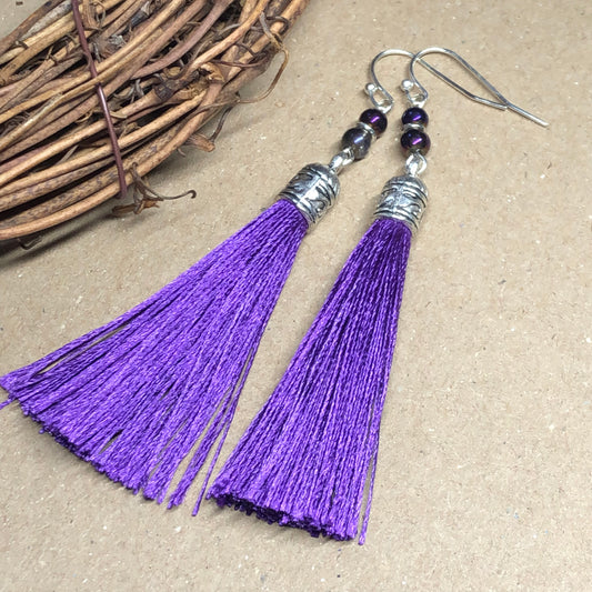 Purple tassel earrings with glass beads