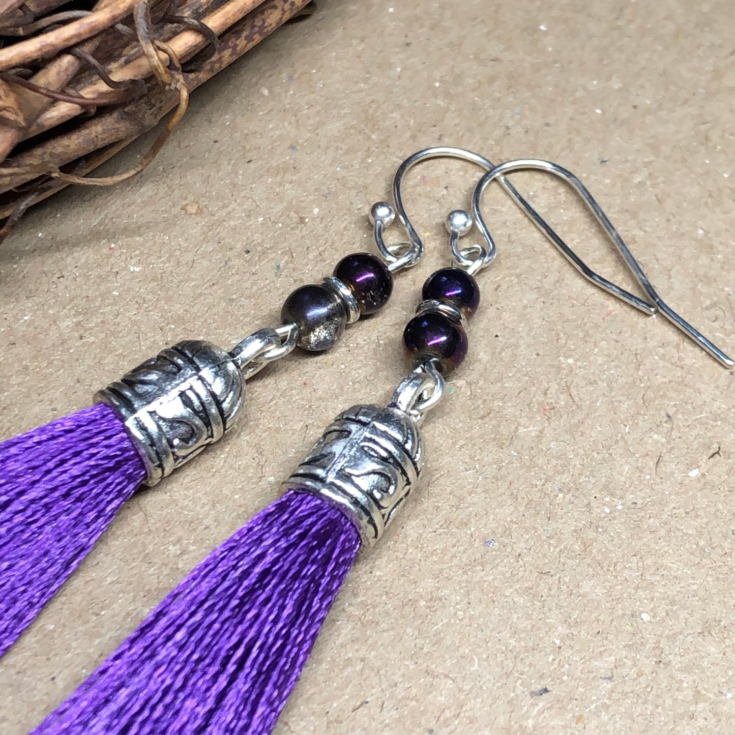 Purple tassel earrings with glass beads