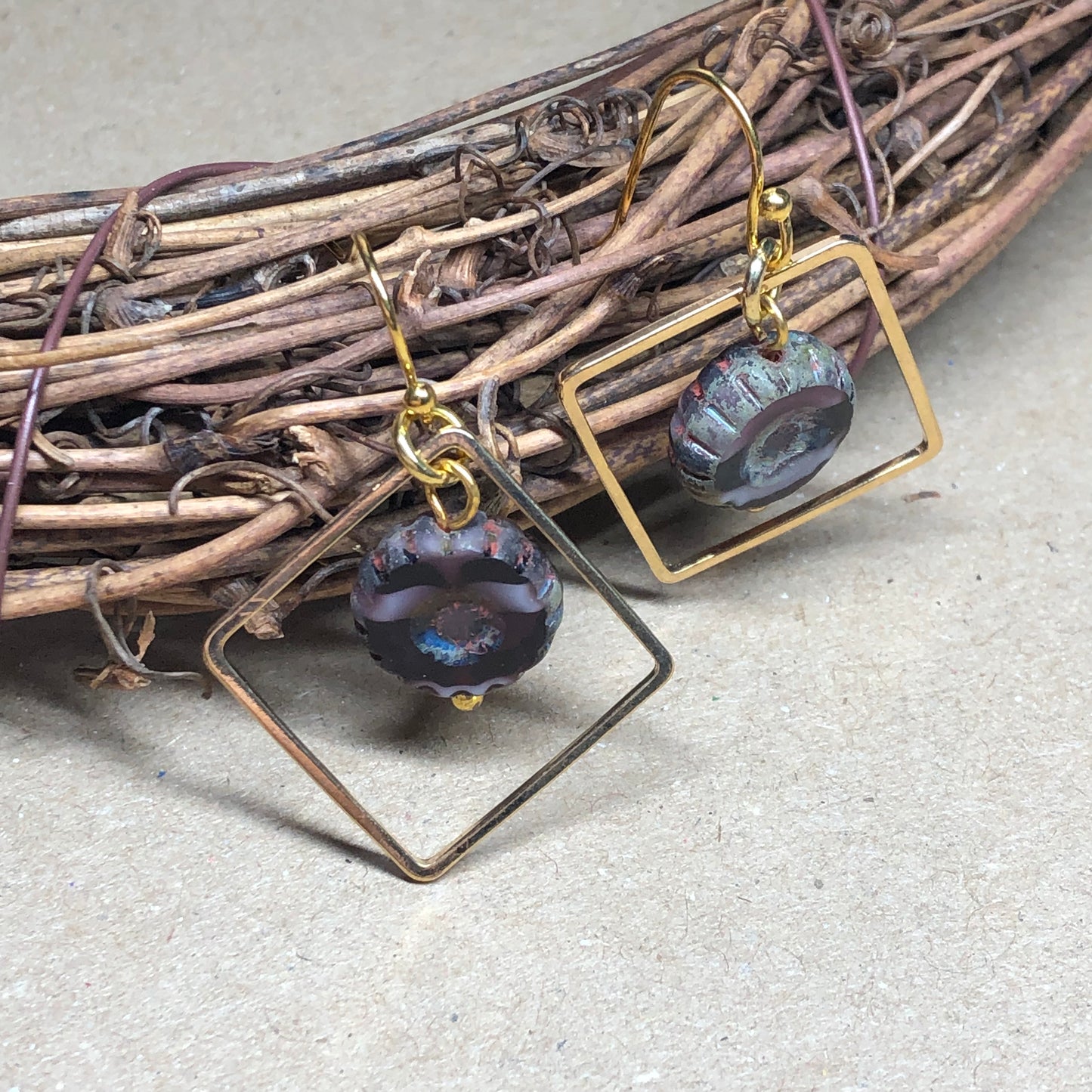 Gold diamond hoop earrings with purple Czech glass flower beads