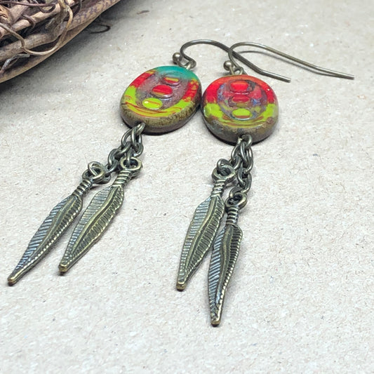 Feather charm earrings with red and green glass beads