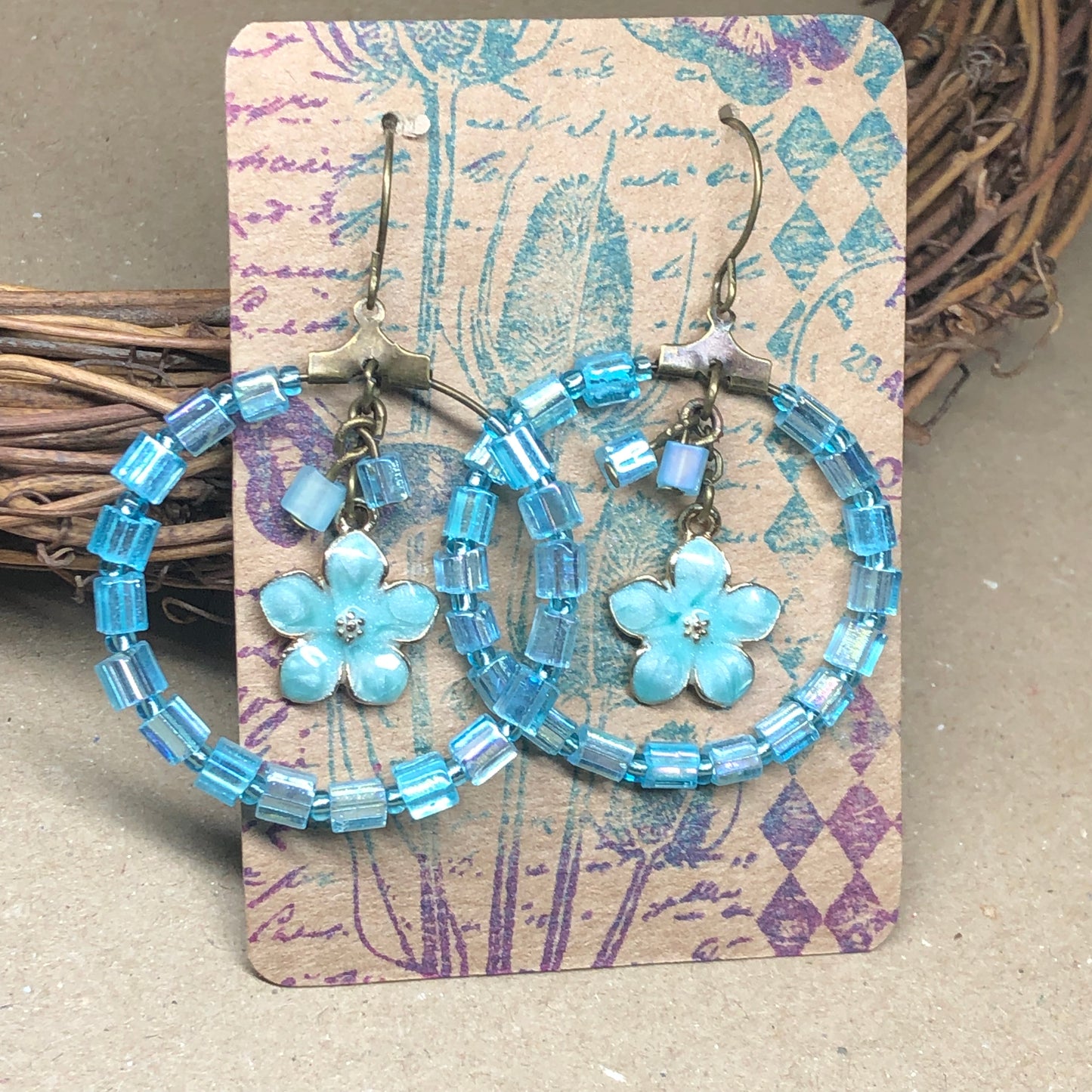 Blue hoop flower charm earrings