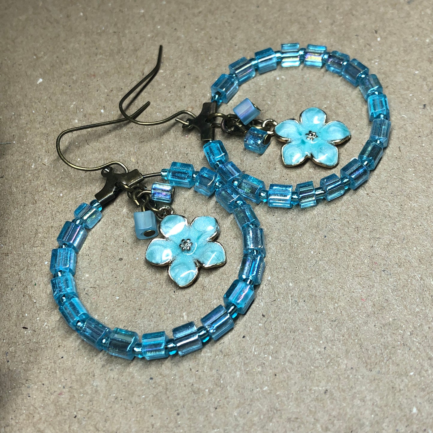 Blue hoop flower charm earrings