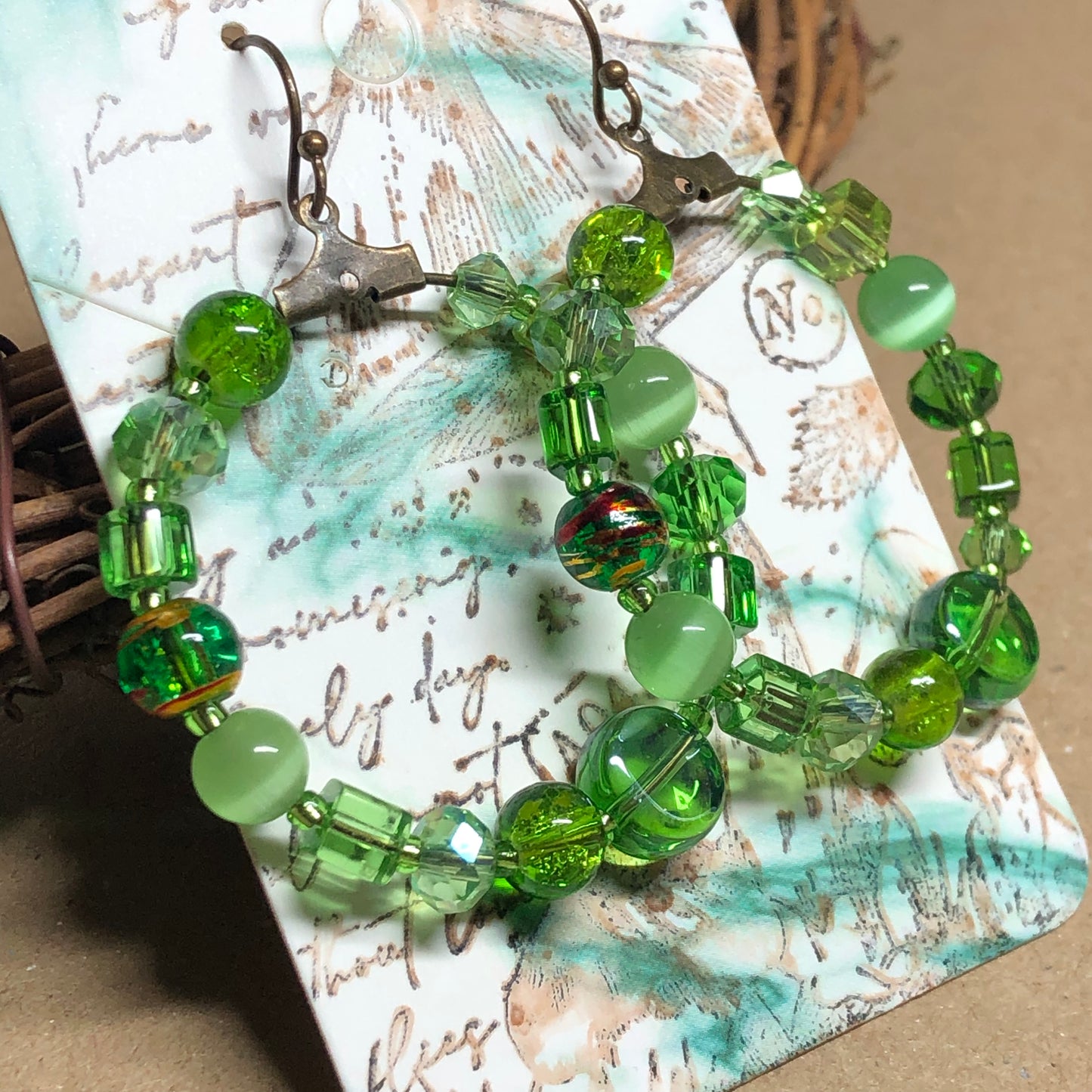 Green bead soup hoop earrings