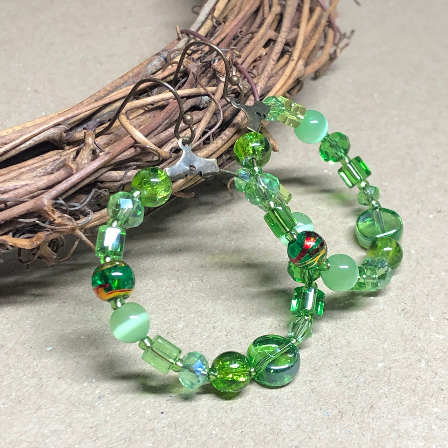 Green bead soup hoop earrings