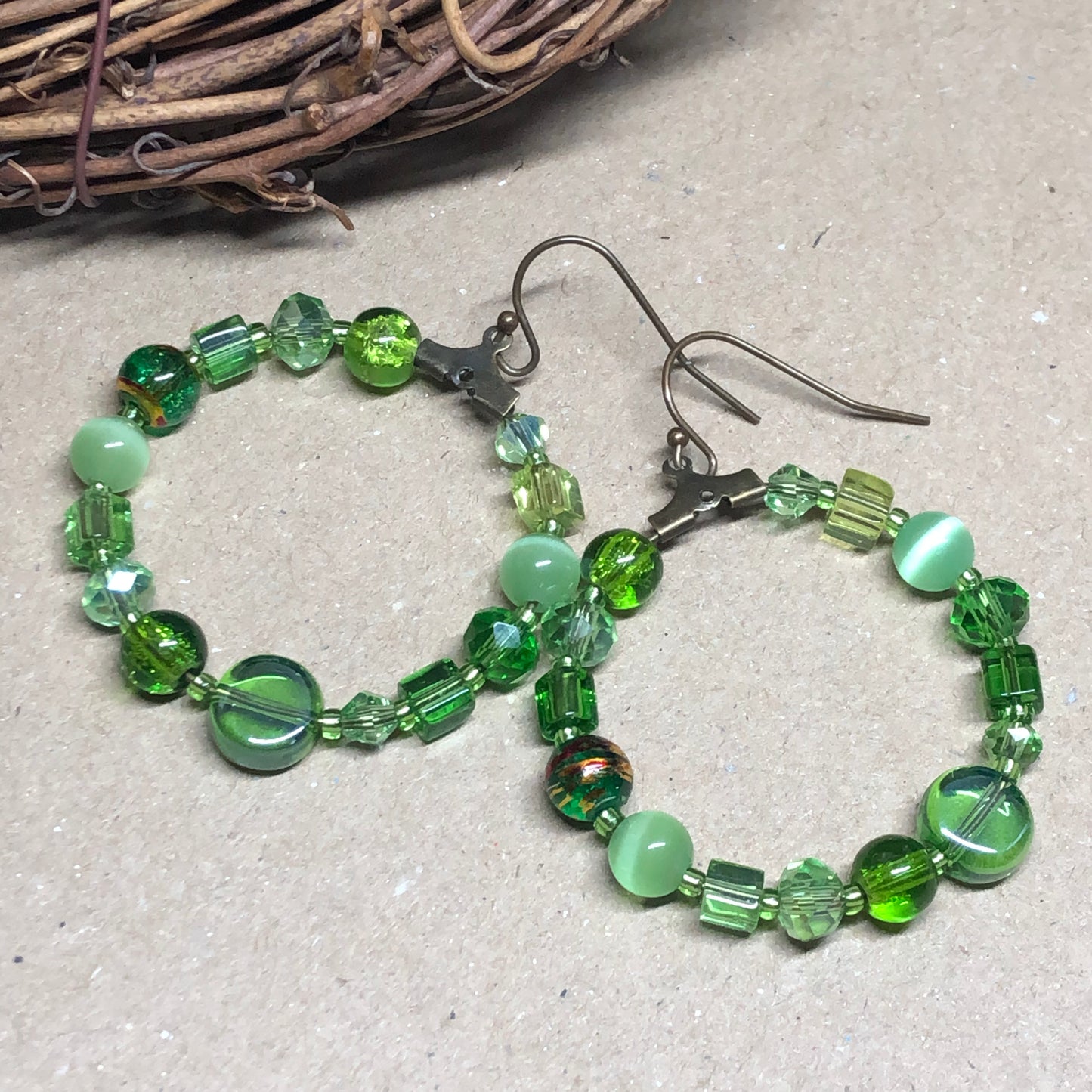 Green bead soup hoop earrings