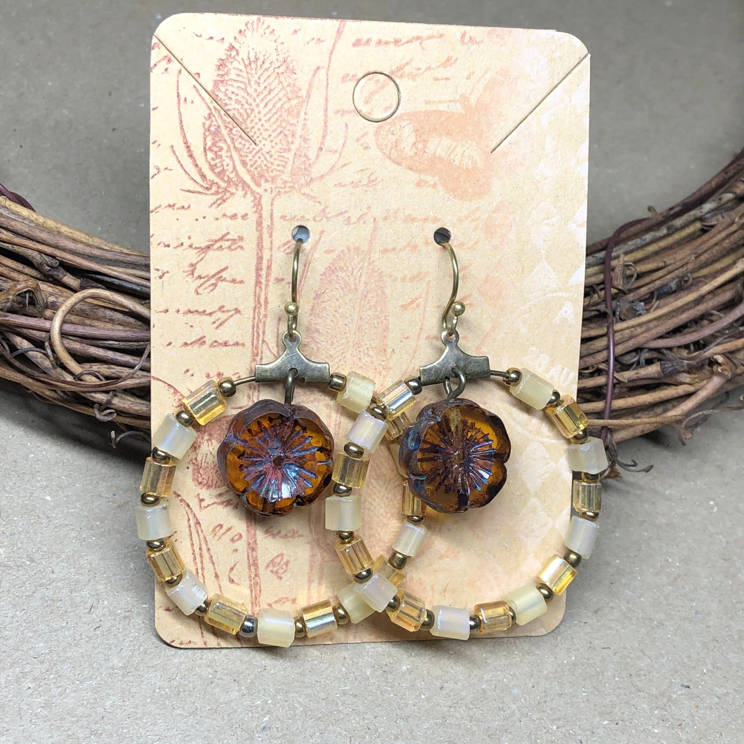 Yellow glass hoop earrings with Amber Czech glass flowers