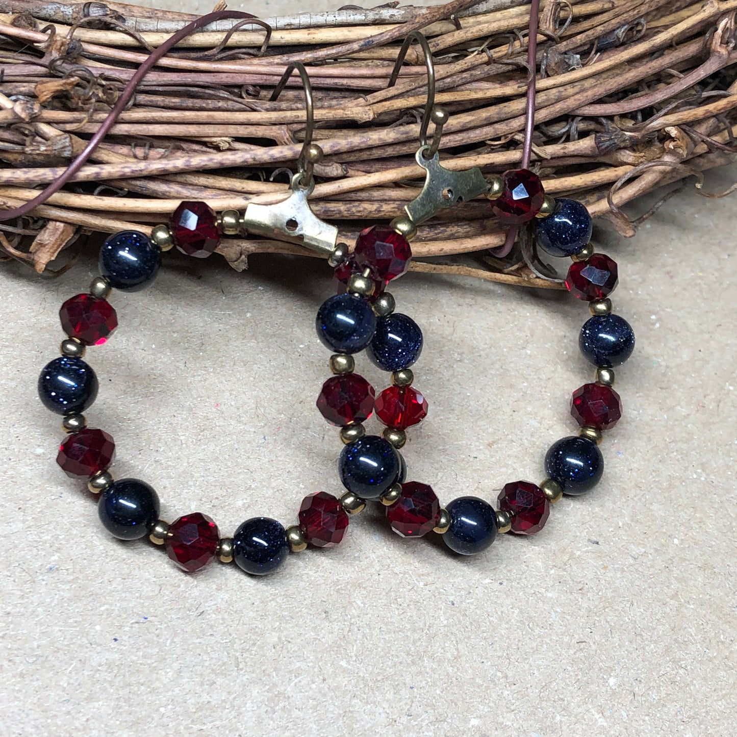 Goldstone and red crystal hoop earrings