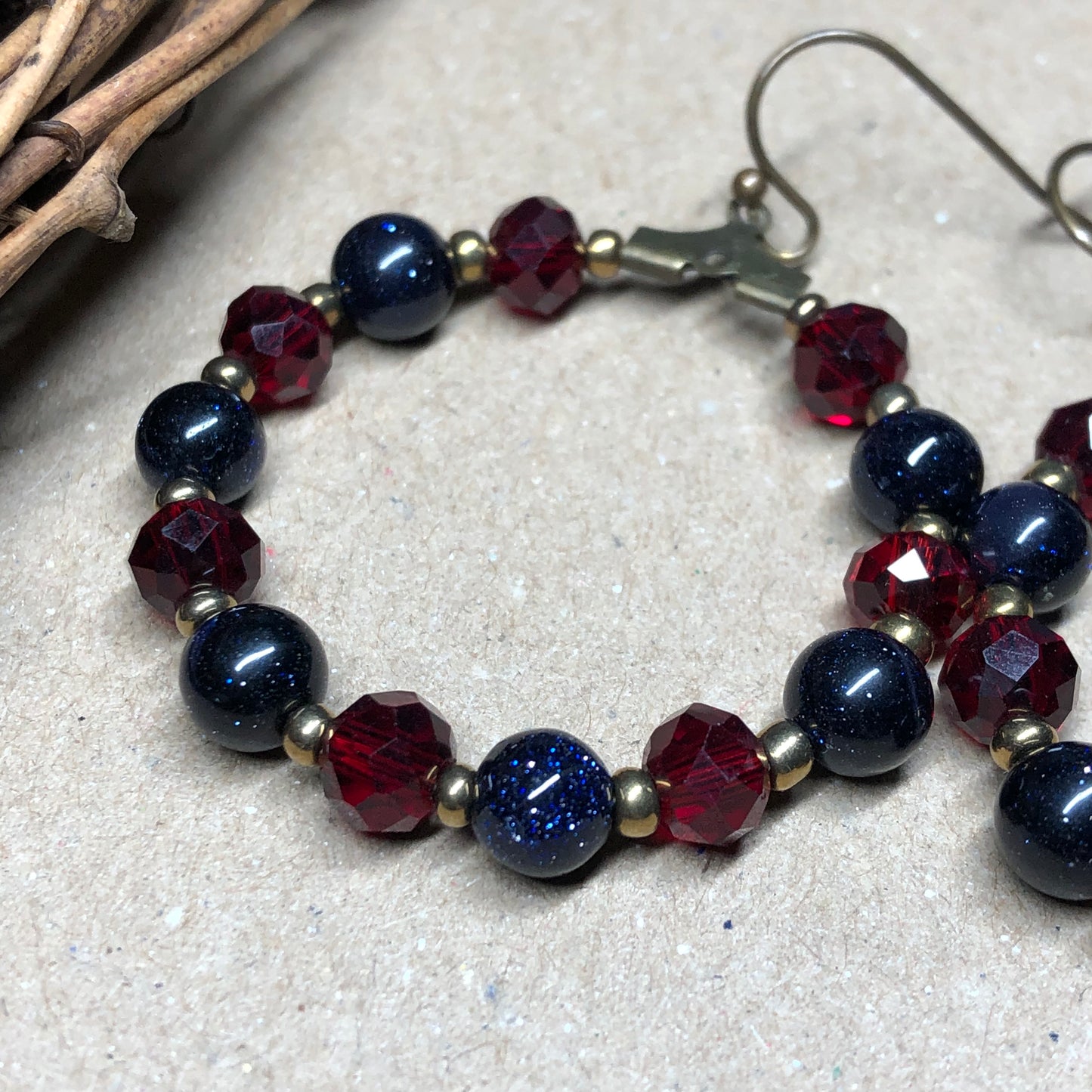 Goldstone and red crystal hoop earrings