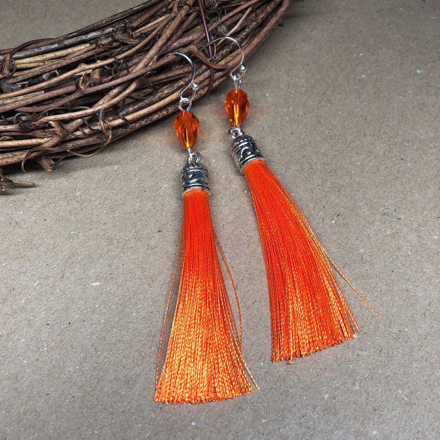 Orange tassel earrings with crystals