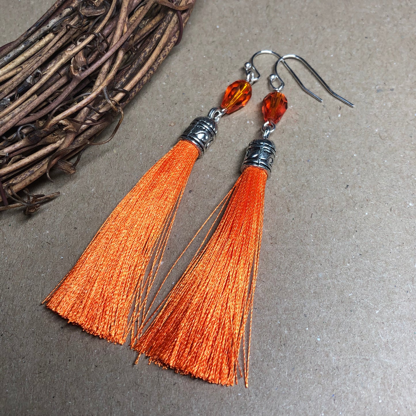 Orange tassel earrings with crystals