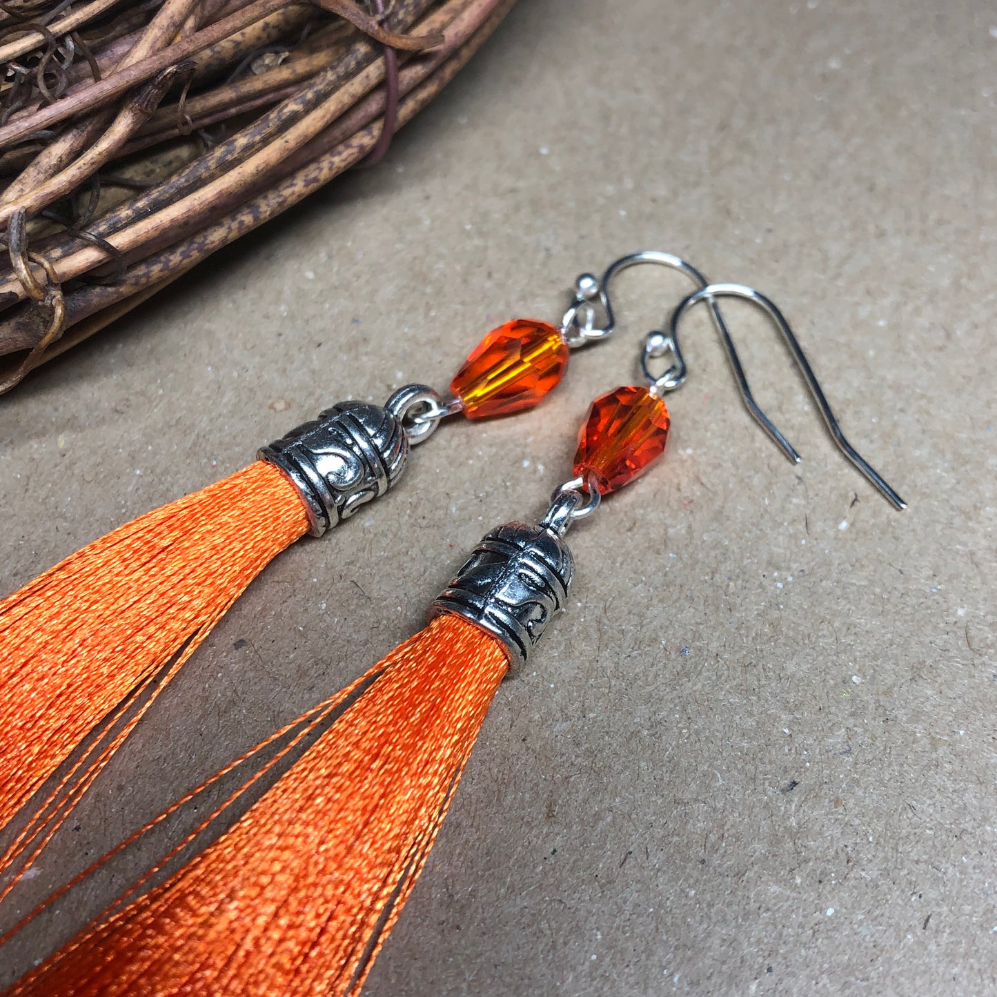 Orange tassel earrings with crystals