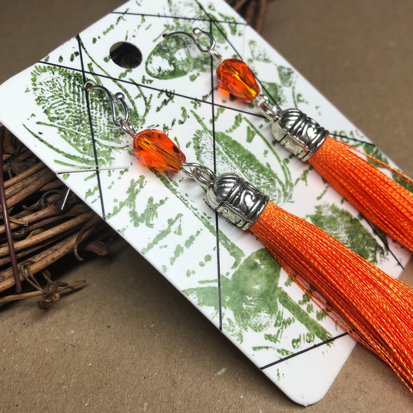 Orange tassel earrings with crystals