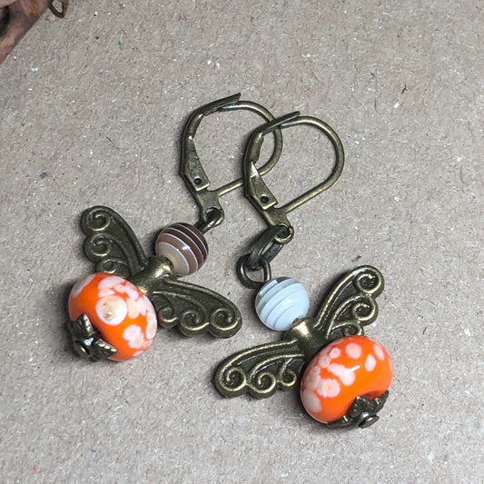 Orange glass bug bronze earrings