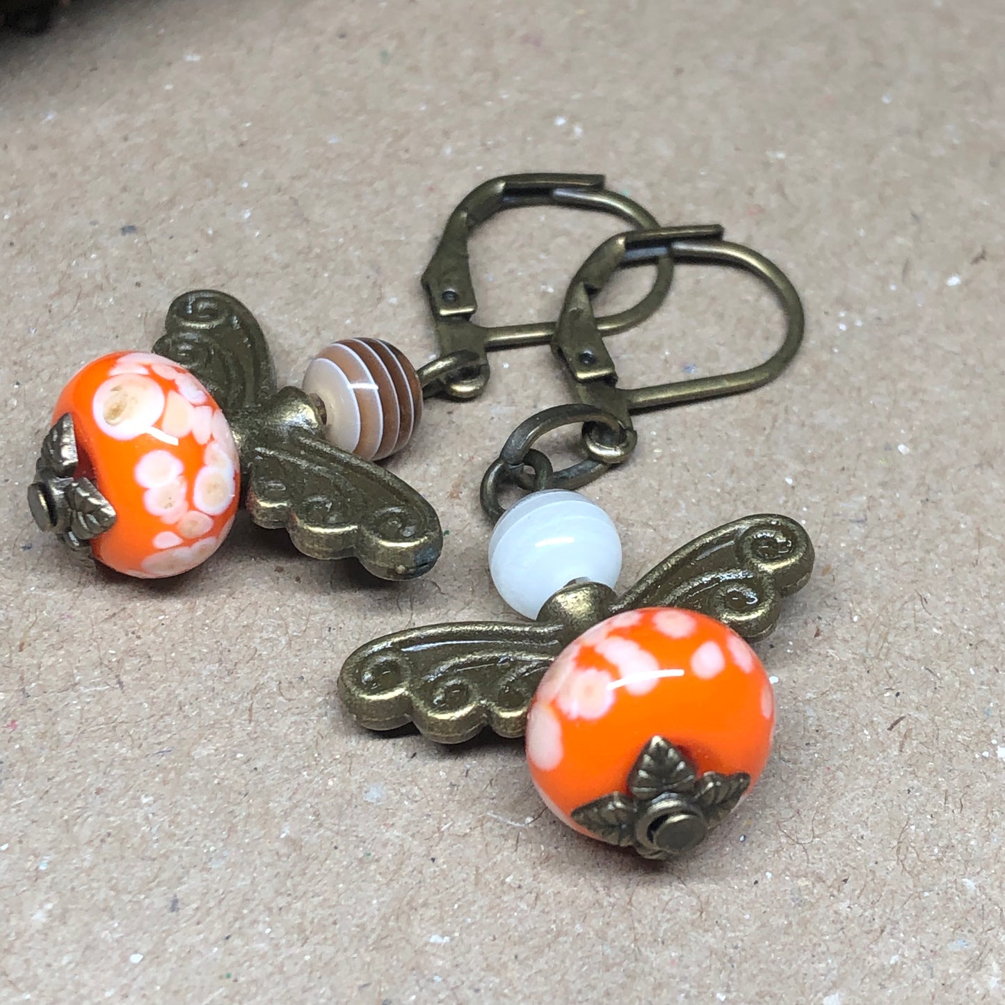 Orange glass bug bronze earrings