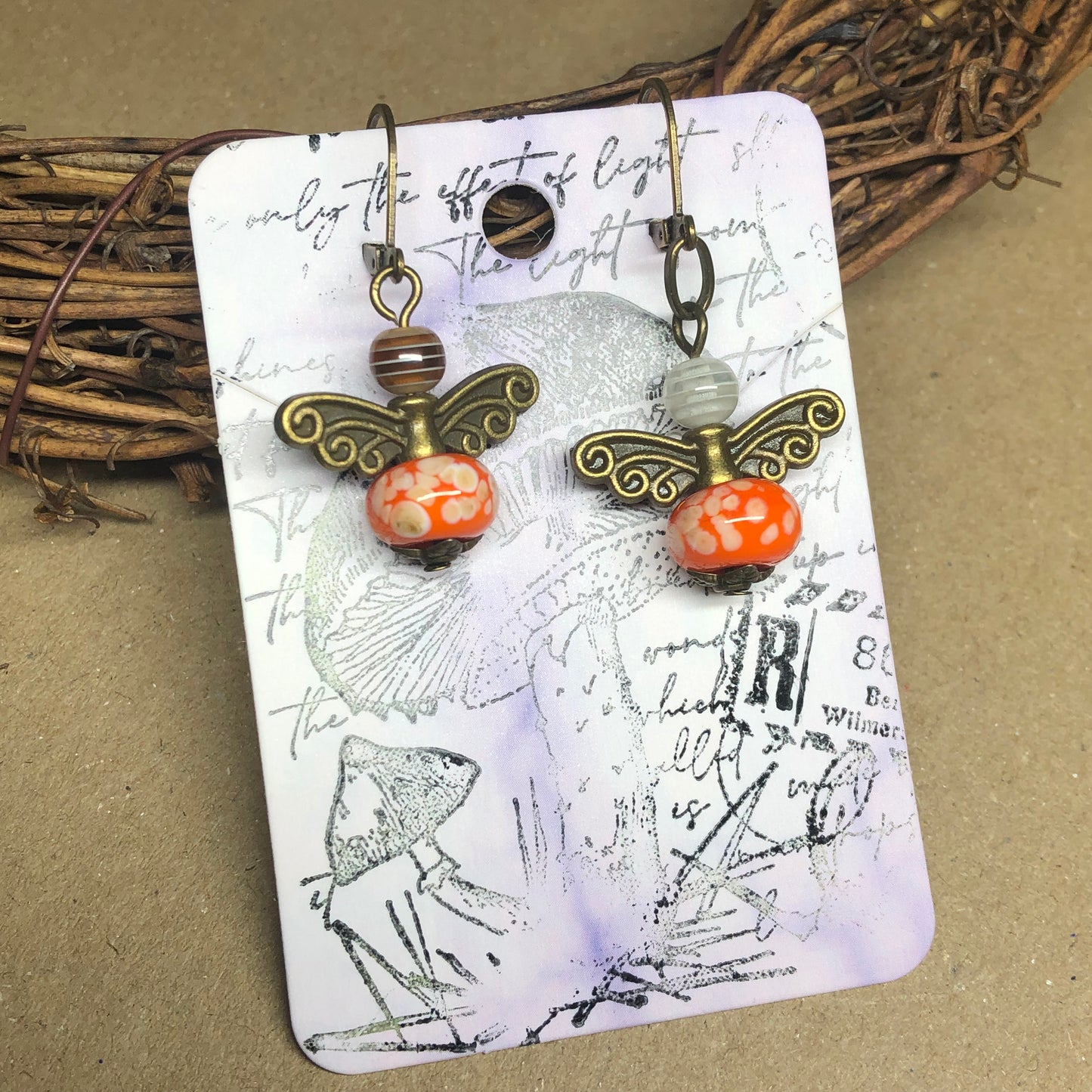 Orange glass bug bronze earrings