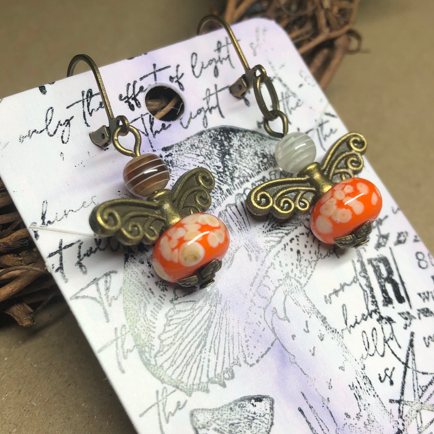 Orange glass bug bronze earrings