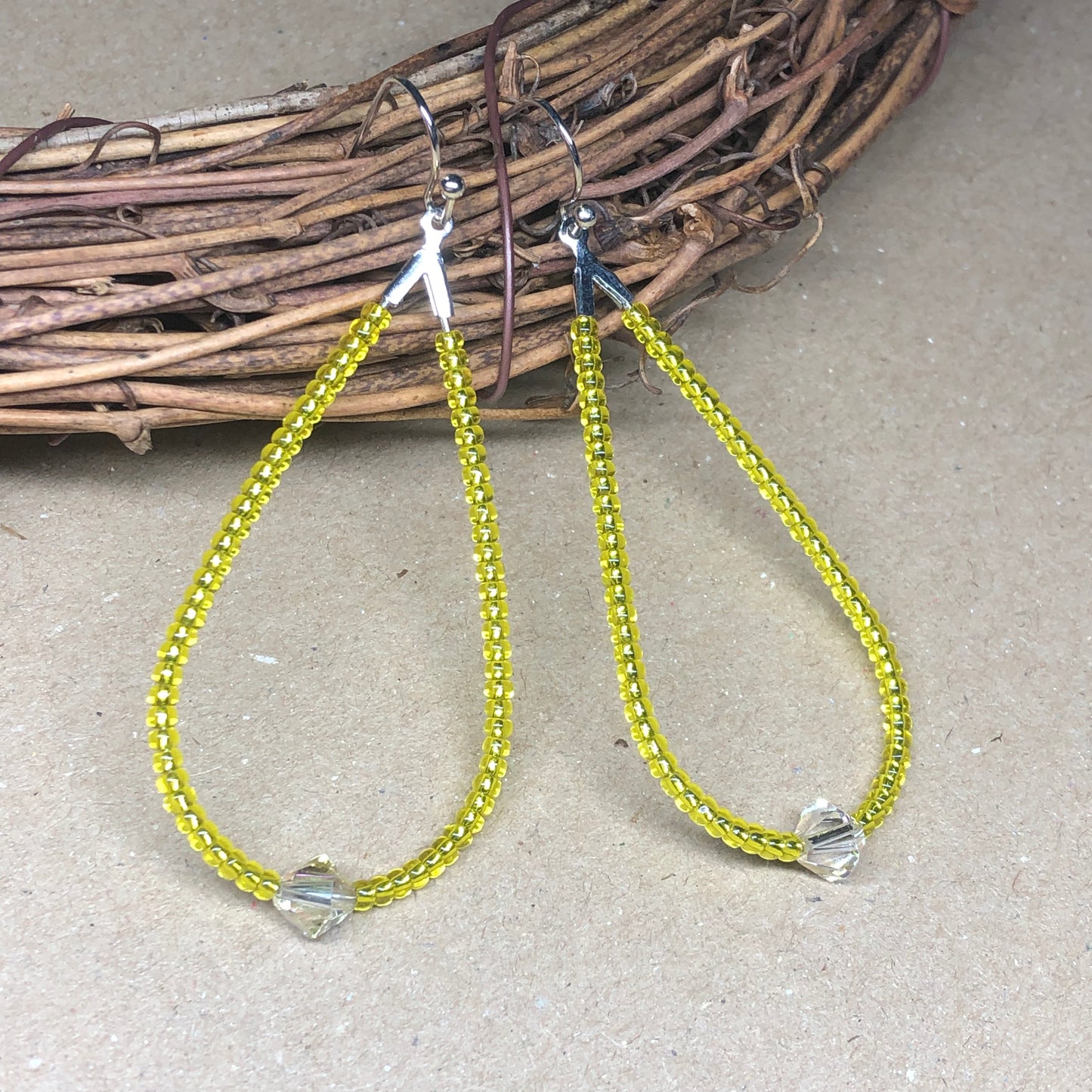 Bright yellow glass peardrop hoop earrings