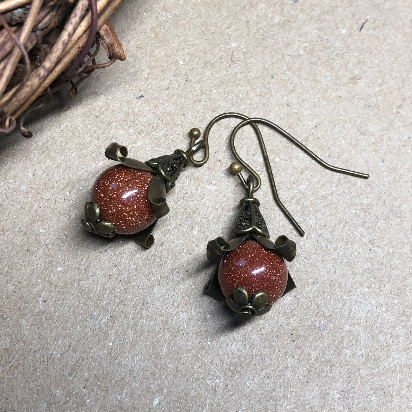 Goldstone bronze flower earrings