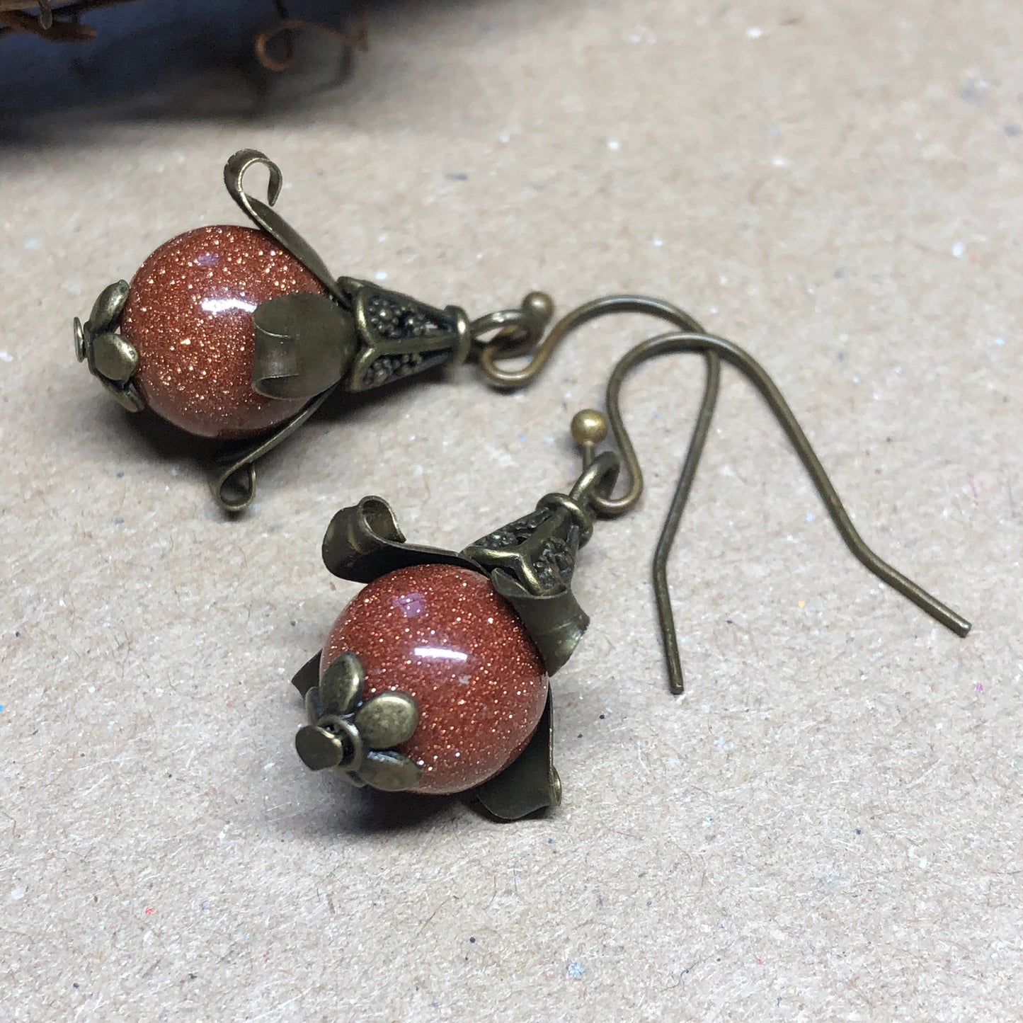 Goldstone bronze flower earrings