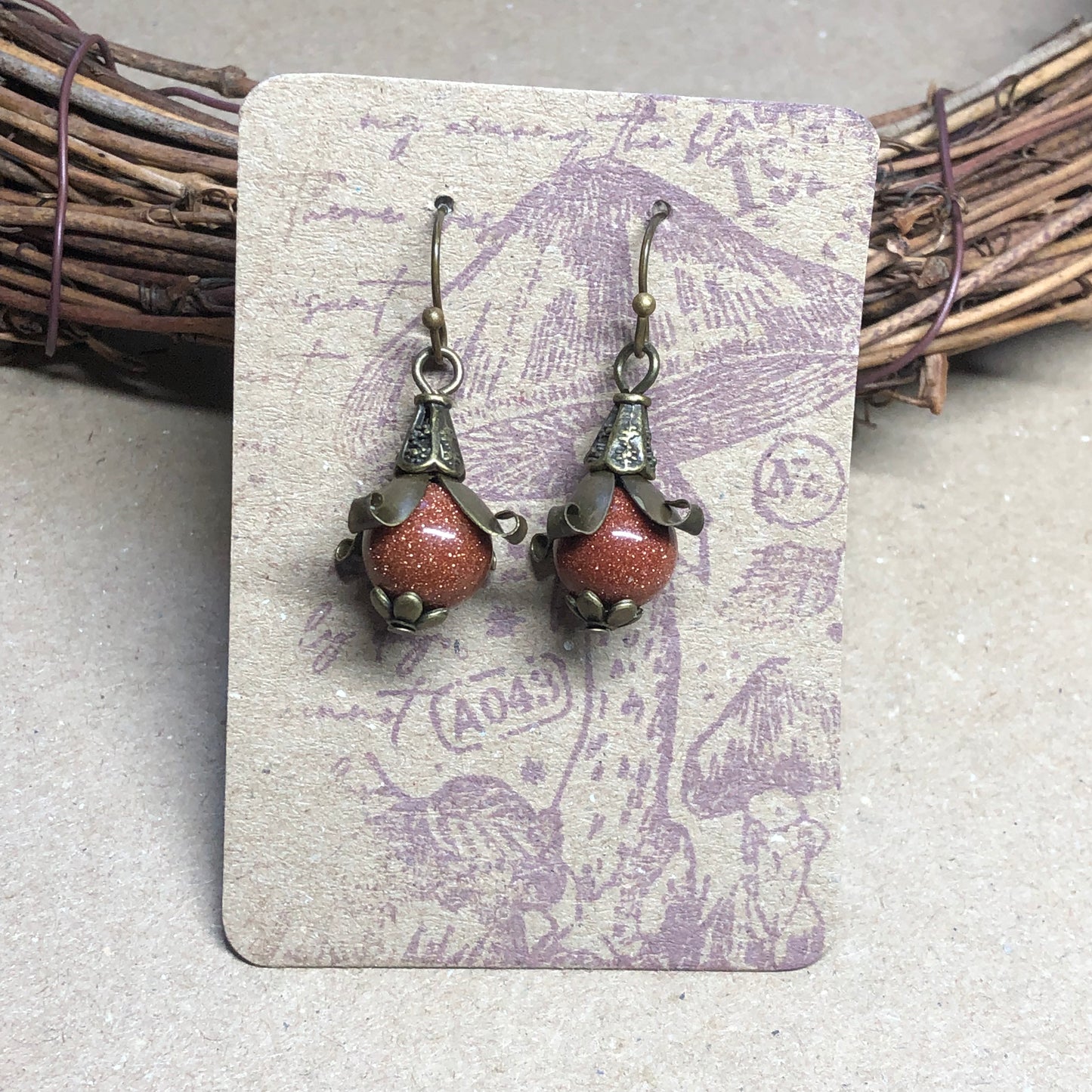 Goldstone bronze flower earrings