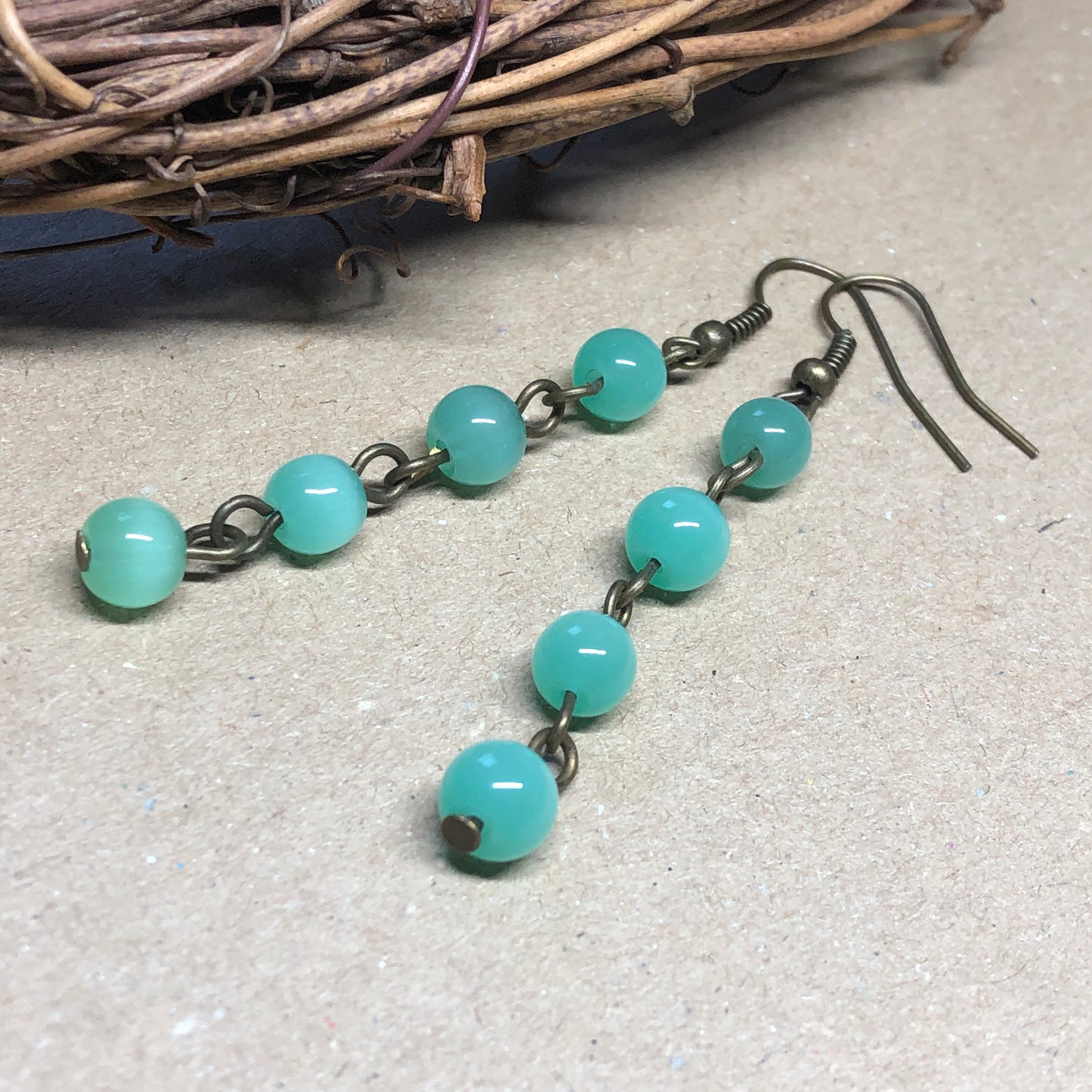 Green glass cats eye earrings