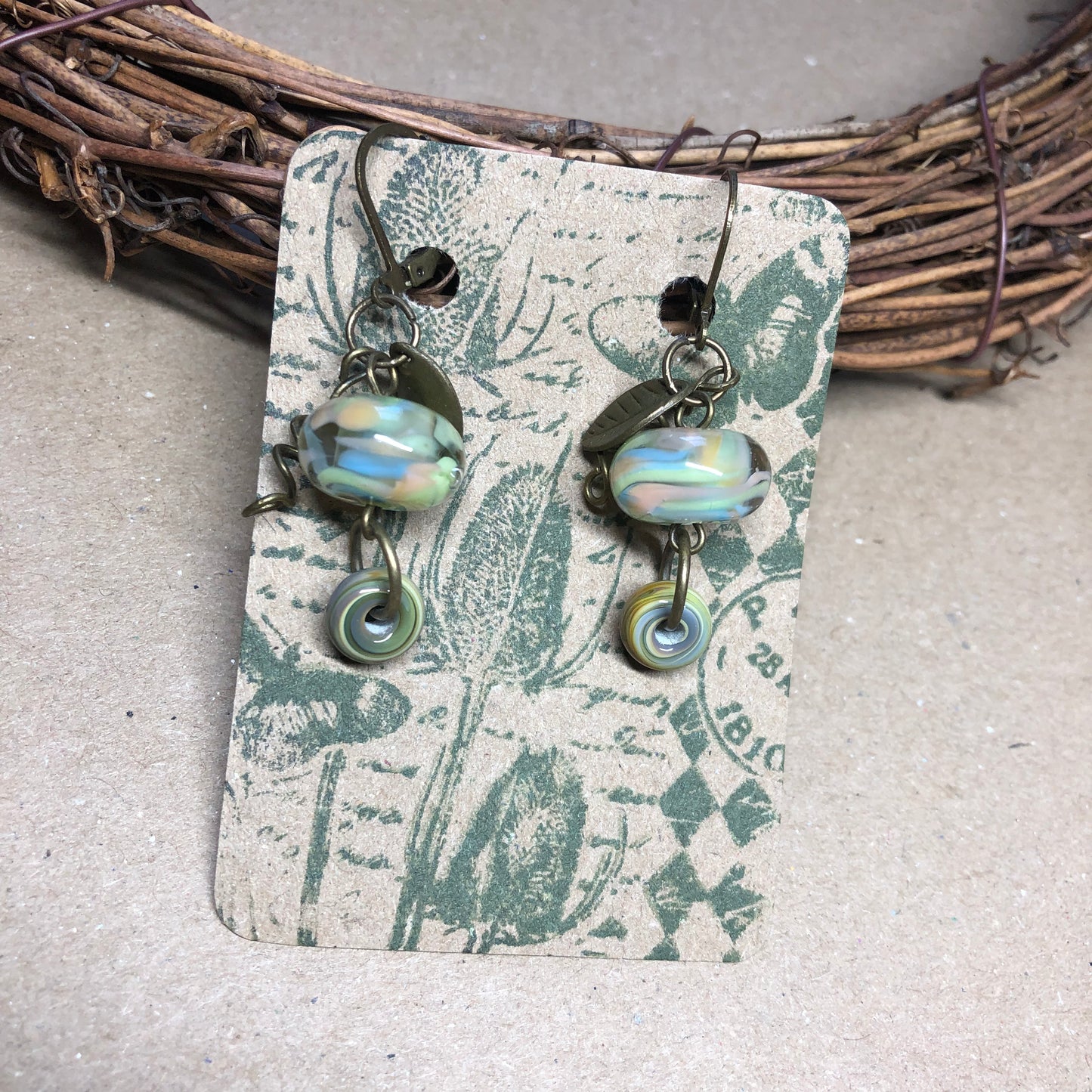 Green stripe lampwork bead earrings