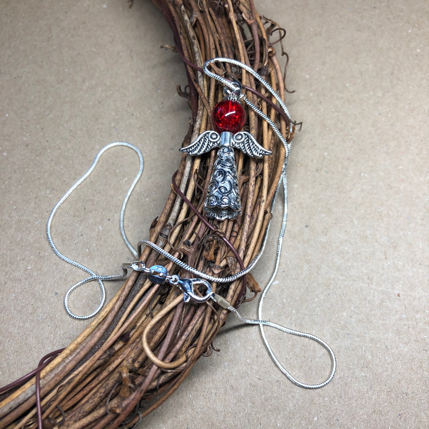 Angel and red crackle glass silver necklace