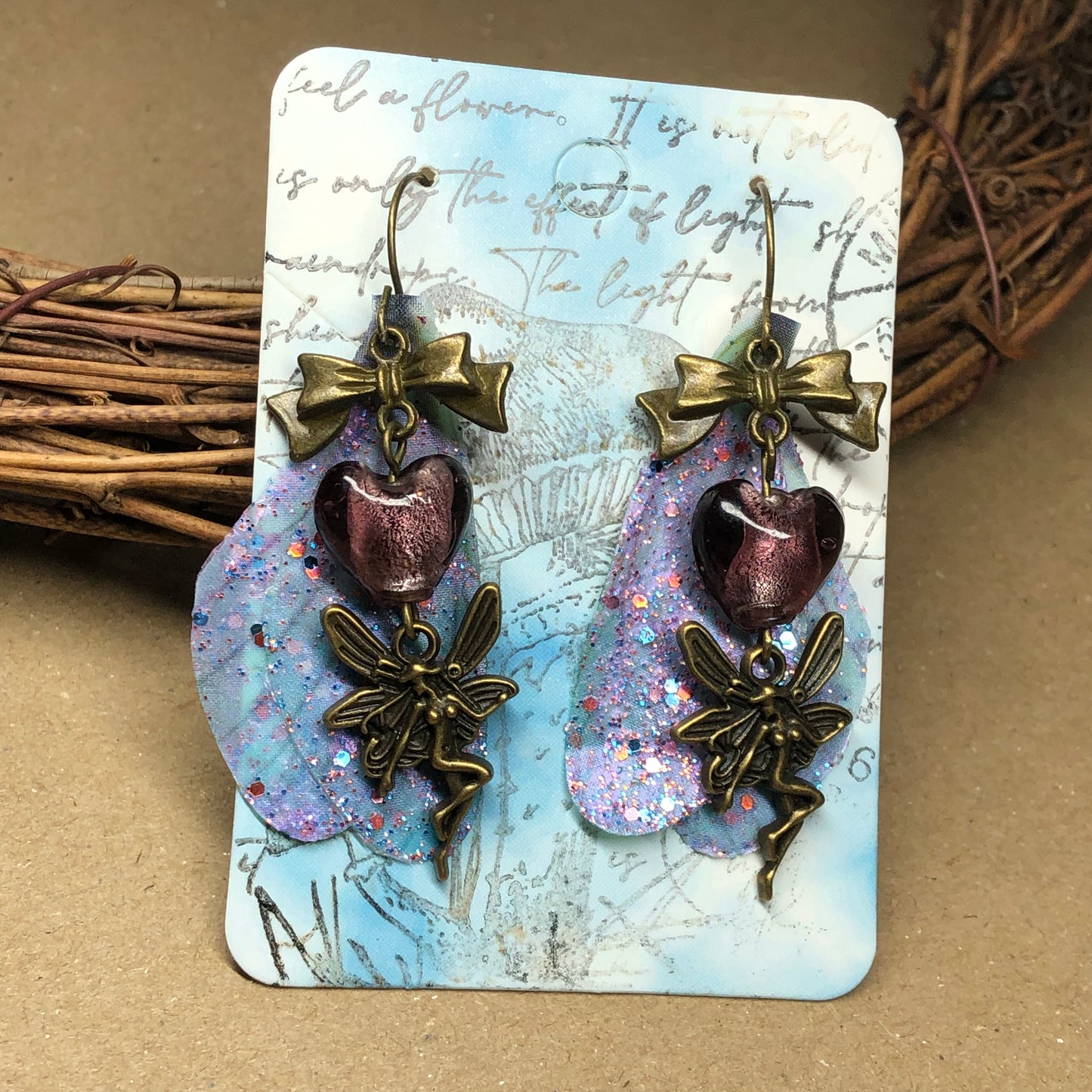 Bronze fairy wing earrings with plum hearts