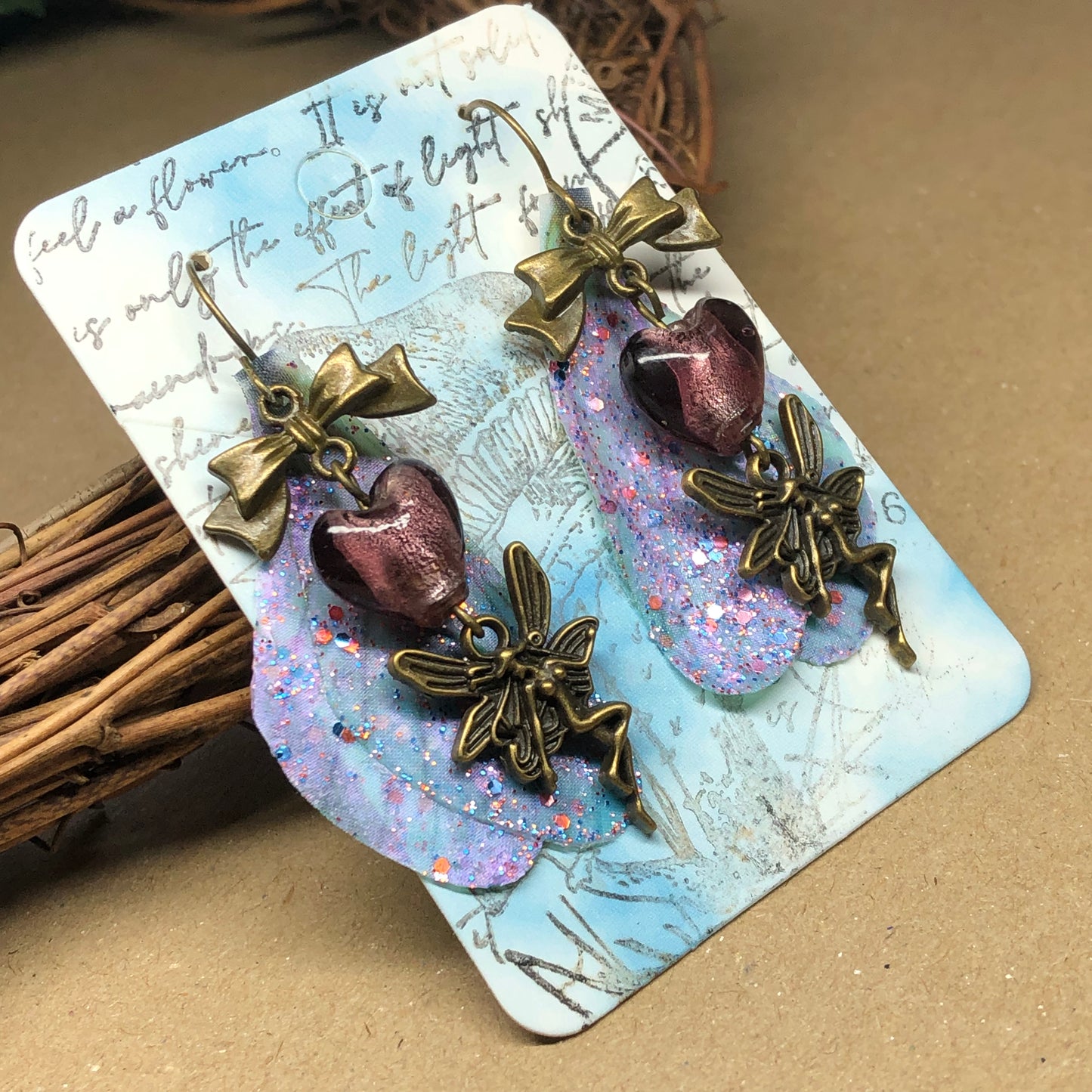 Bronze fairy wing earrings with plum hearts