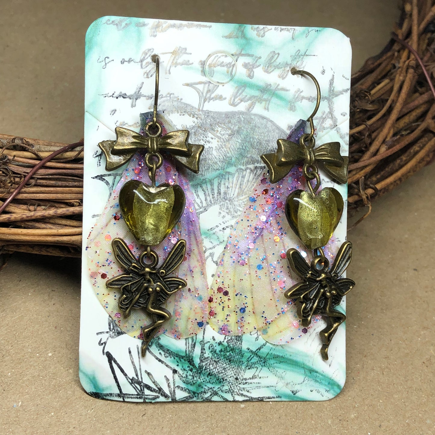 Bronze fairy wing earrings with olive hearts