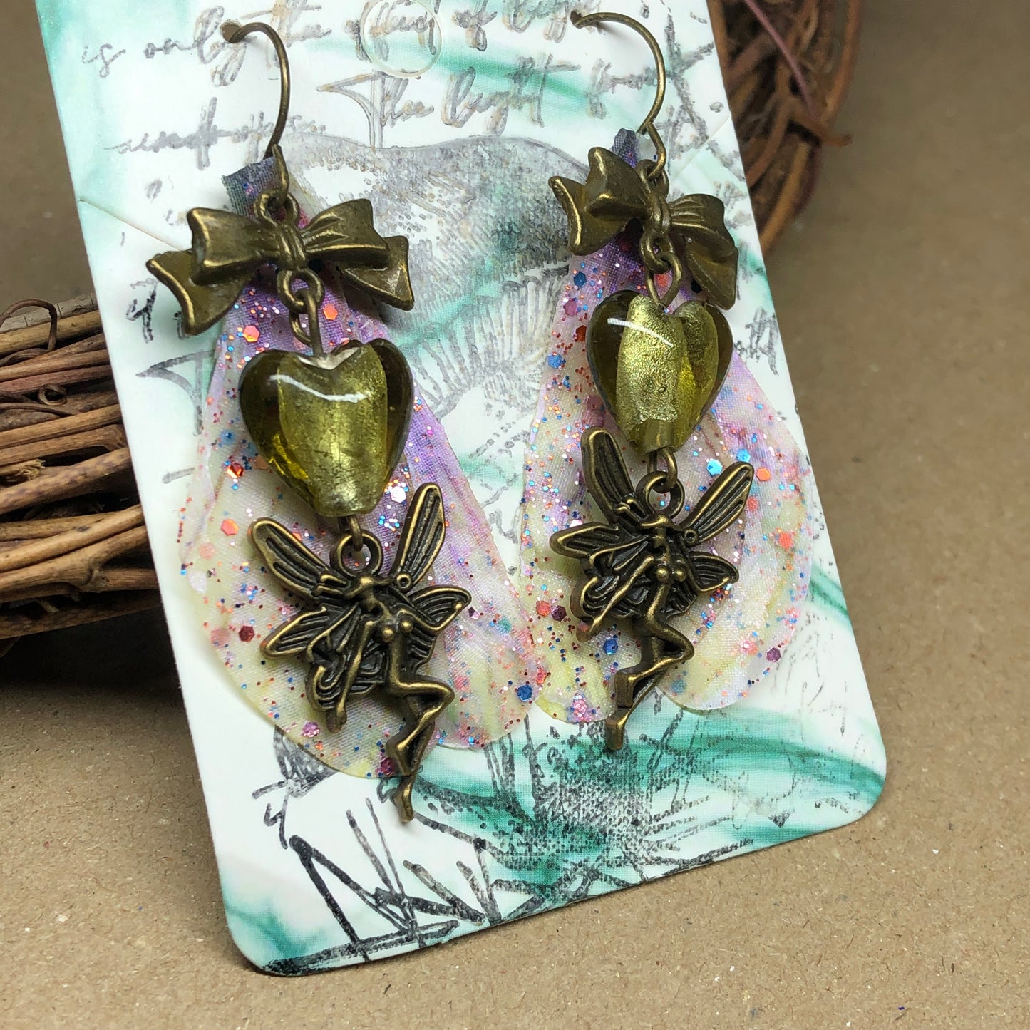 Bronze fairy wing earrings with olive hearts