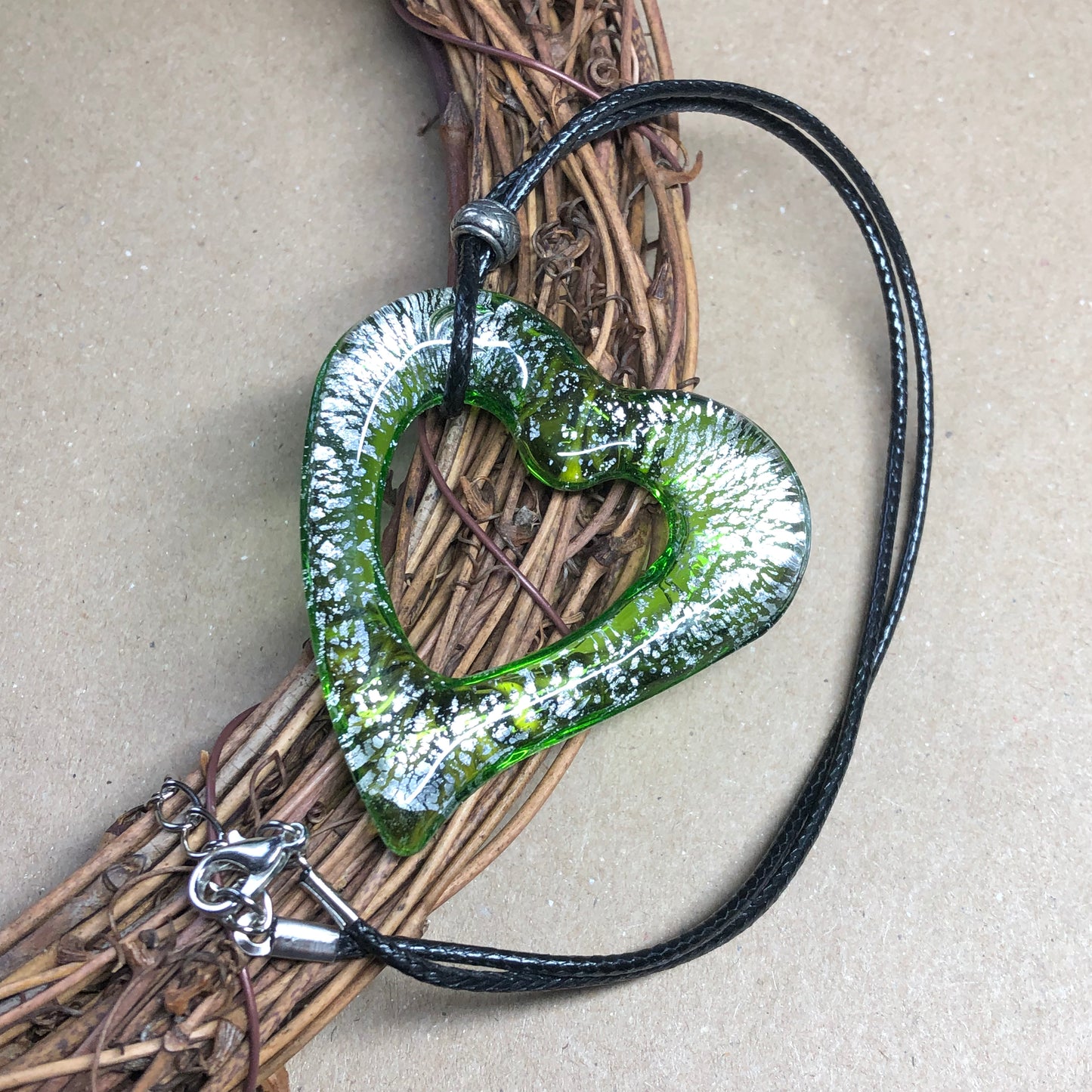 Black choker with large green heart