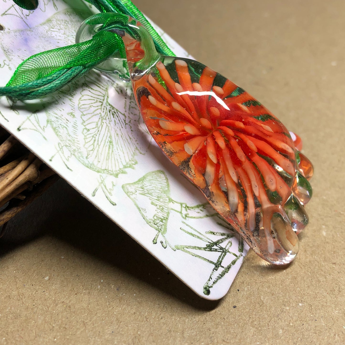 Green choker with large orange foot